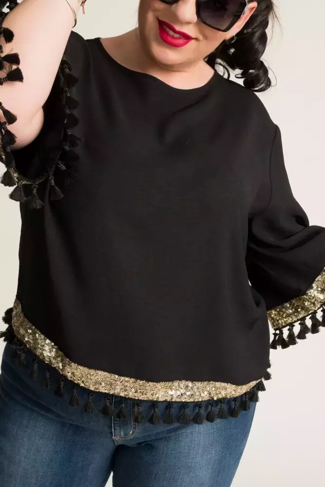 Blusa negra y dorada con borlas
